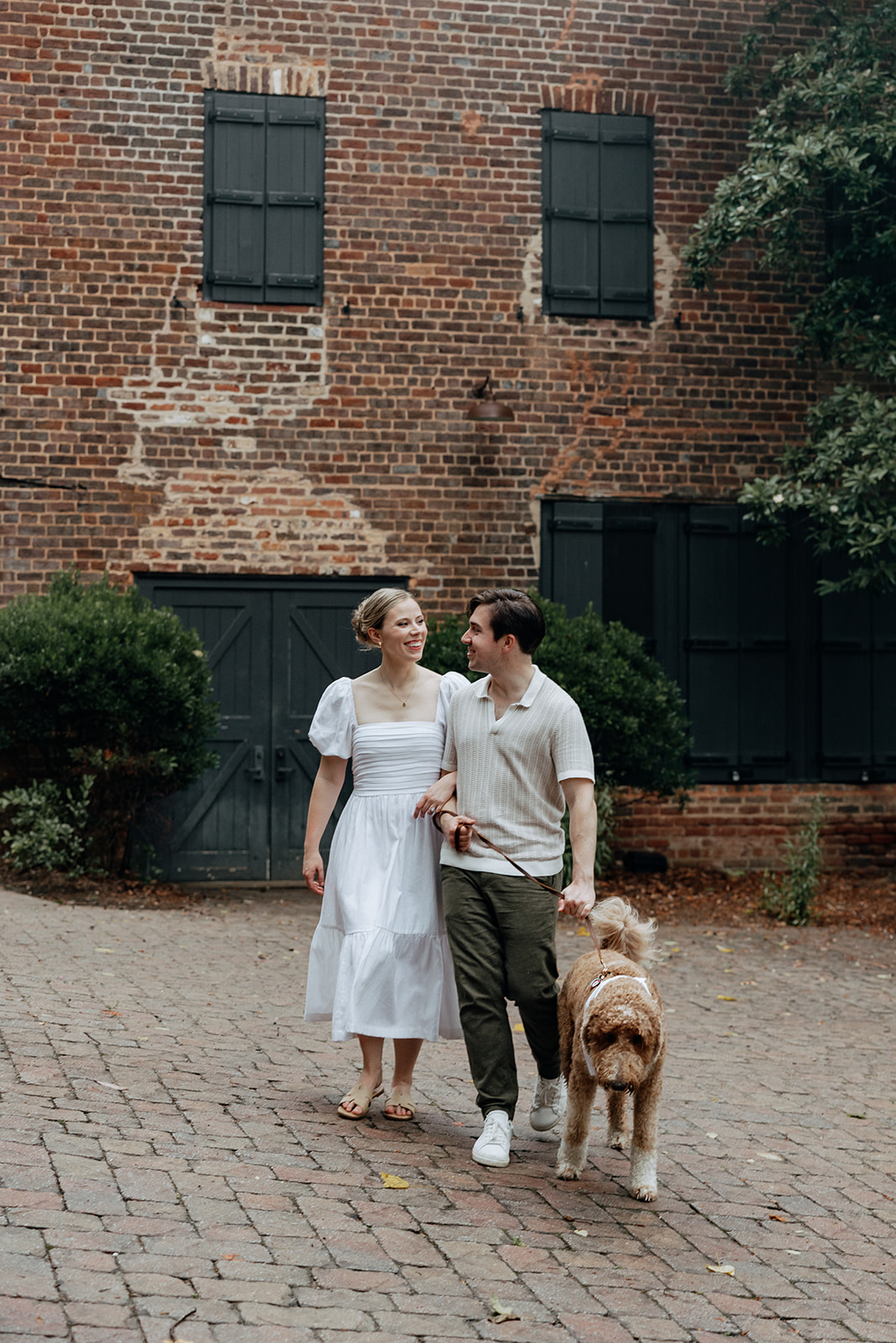 couple at engagement session on a rainy day