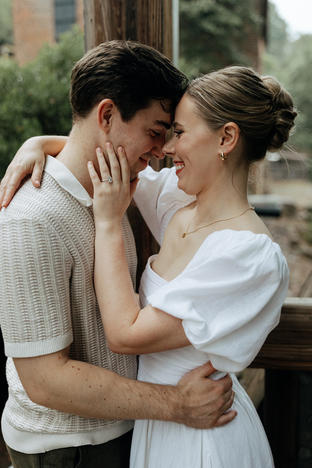 couple at engagement session on a rainy day