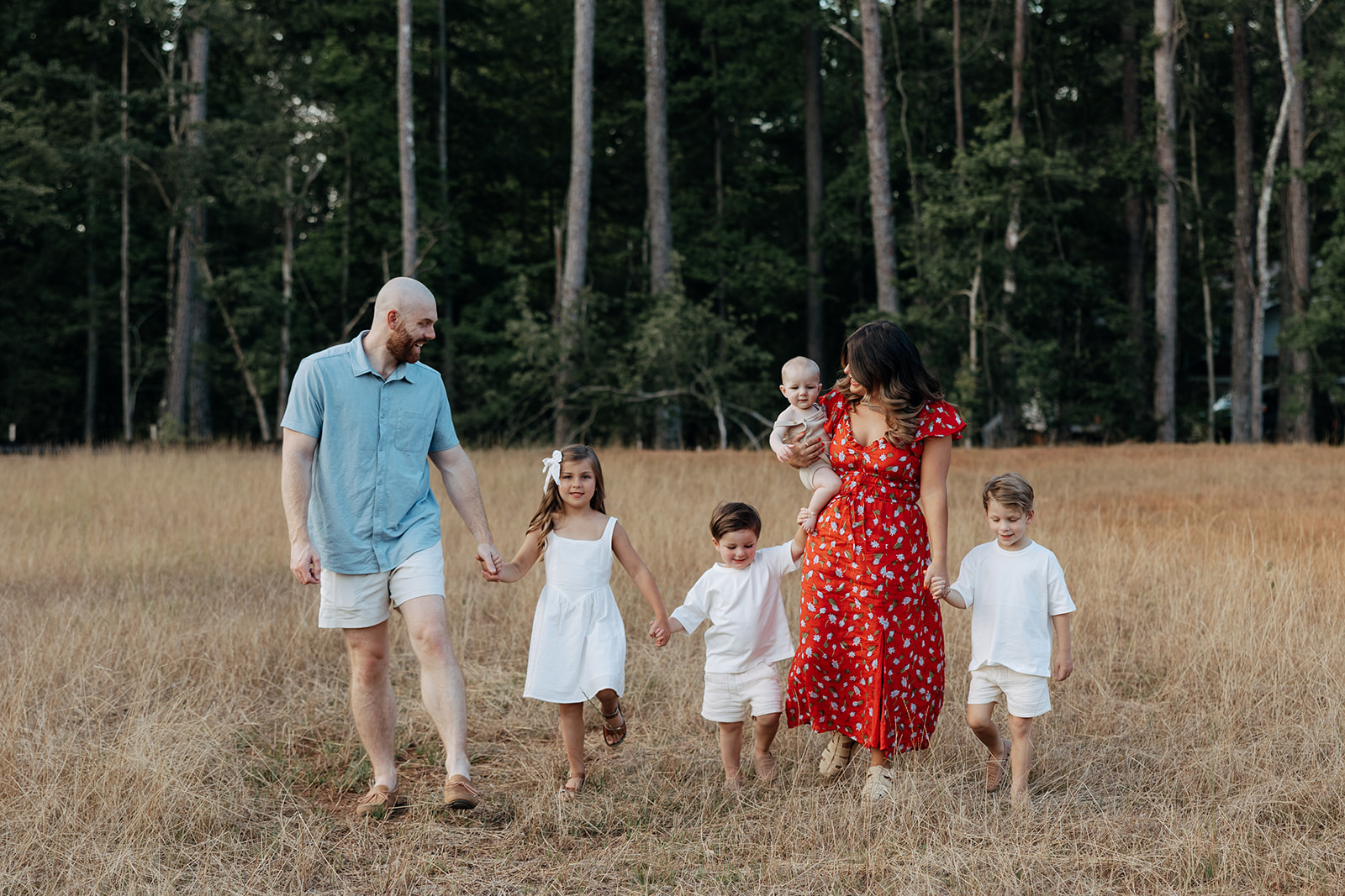 stunning family walks together during their Atlanta family portraits