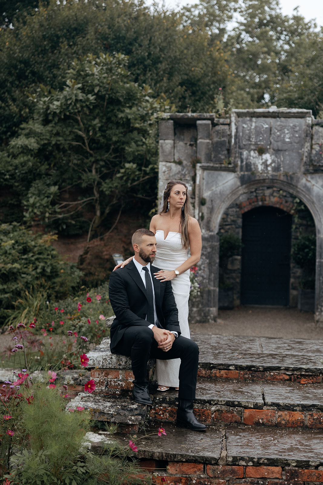stunning couple pose for photos on the beautiful Dromoland castle grounds
