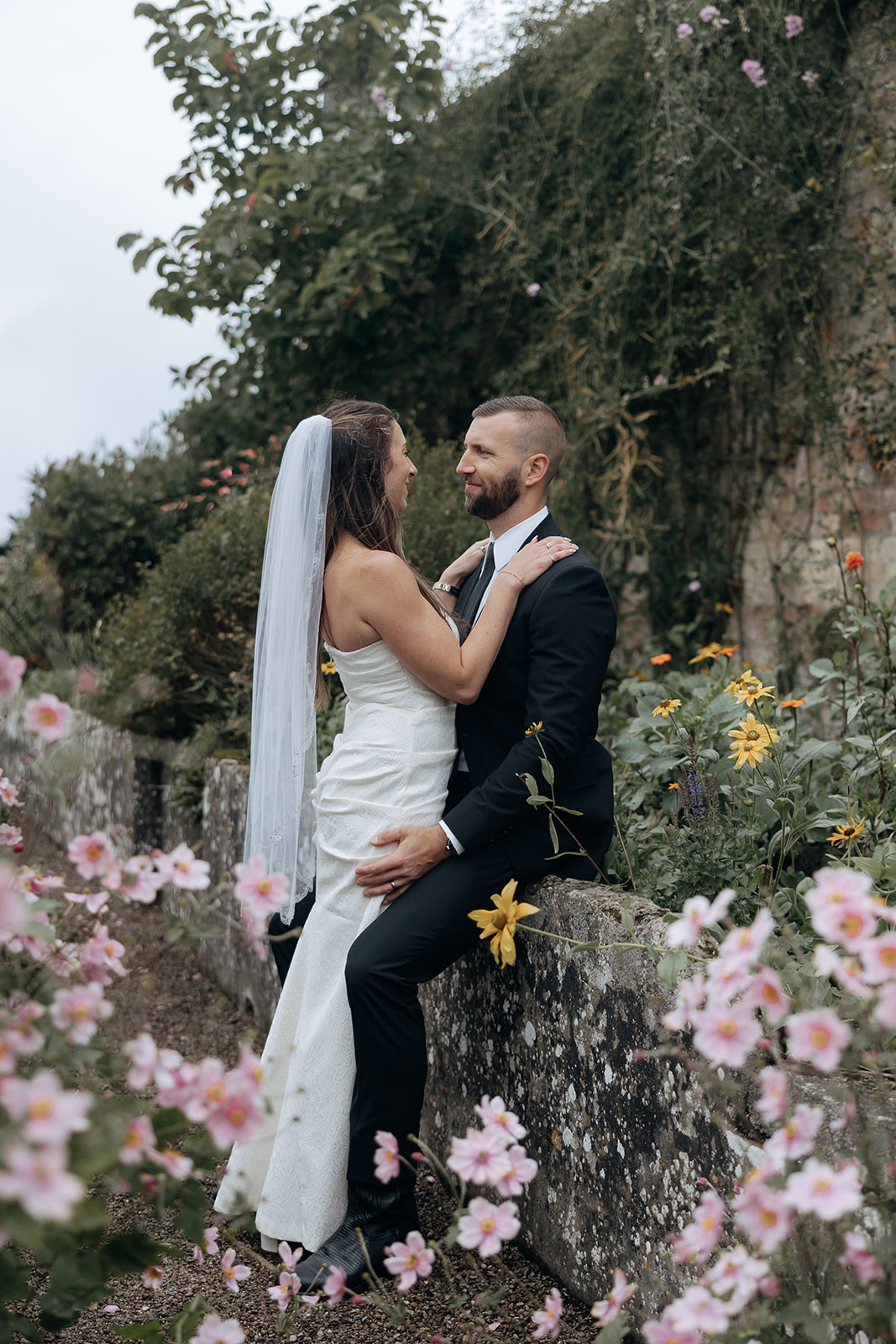 stunning couple pose for photos on the beautiful Dromoland castle grounds