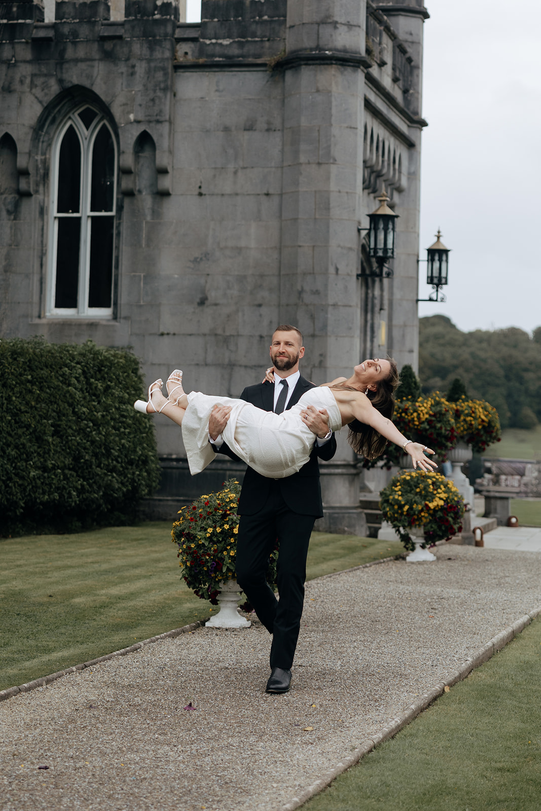 stunning couple pose for photos on the beautiful Dromoland castle grounds