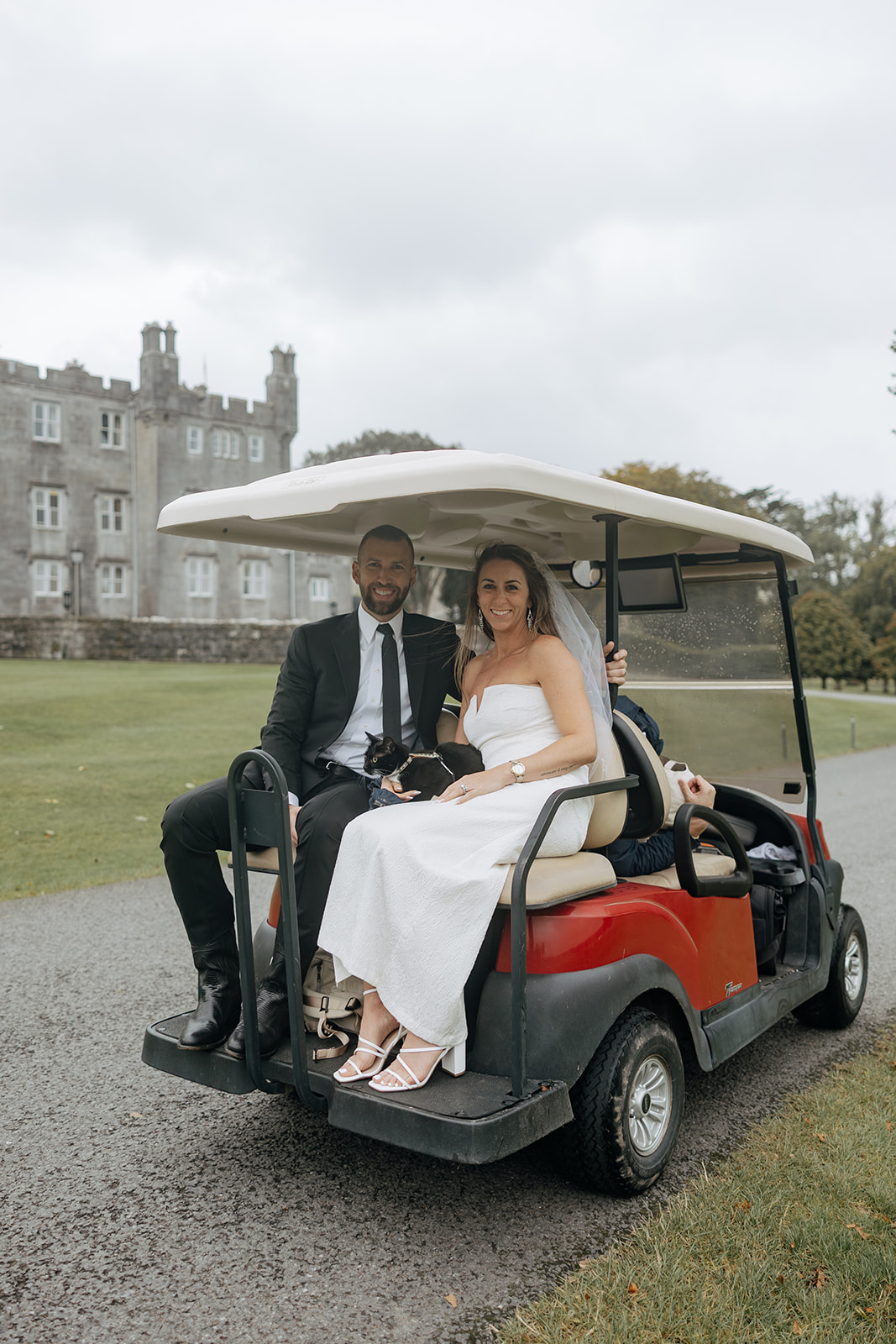 candid photos from a beautiful Ireland vow renewal as they ride on the golf cart