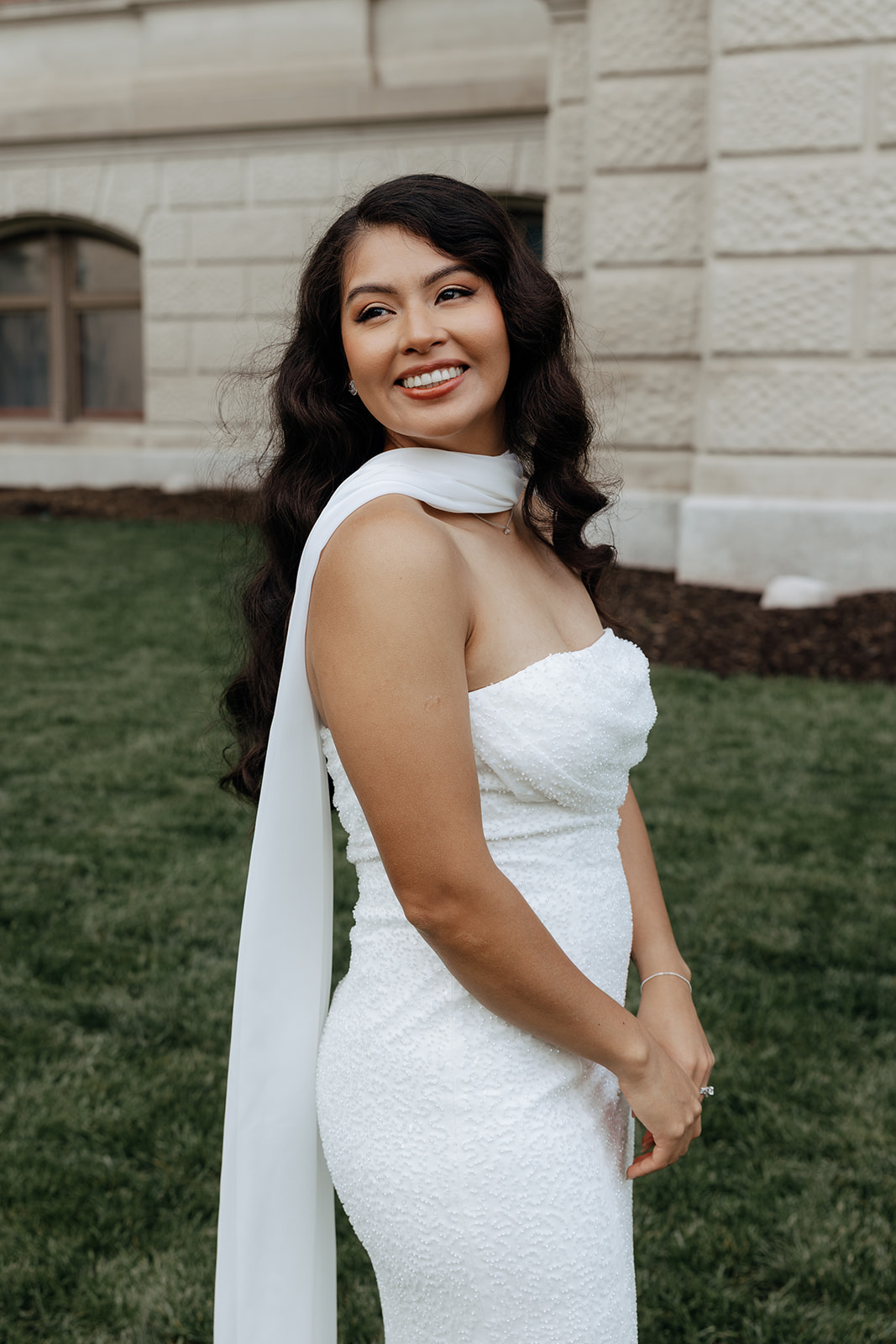 beautiful bride poses for a photo on her elopement day