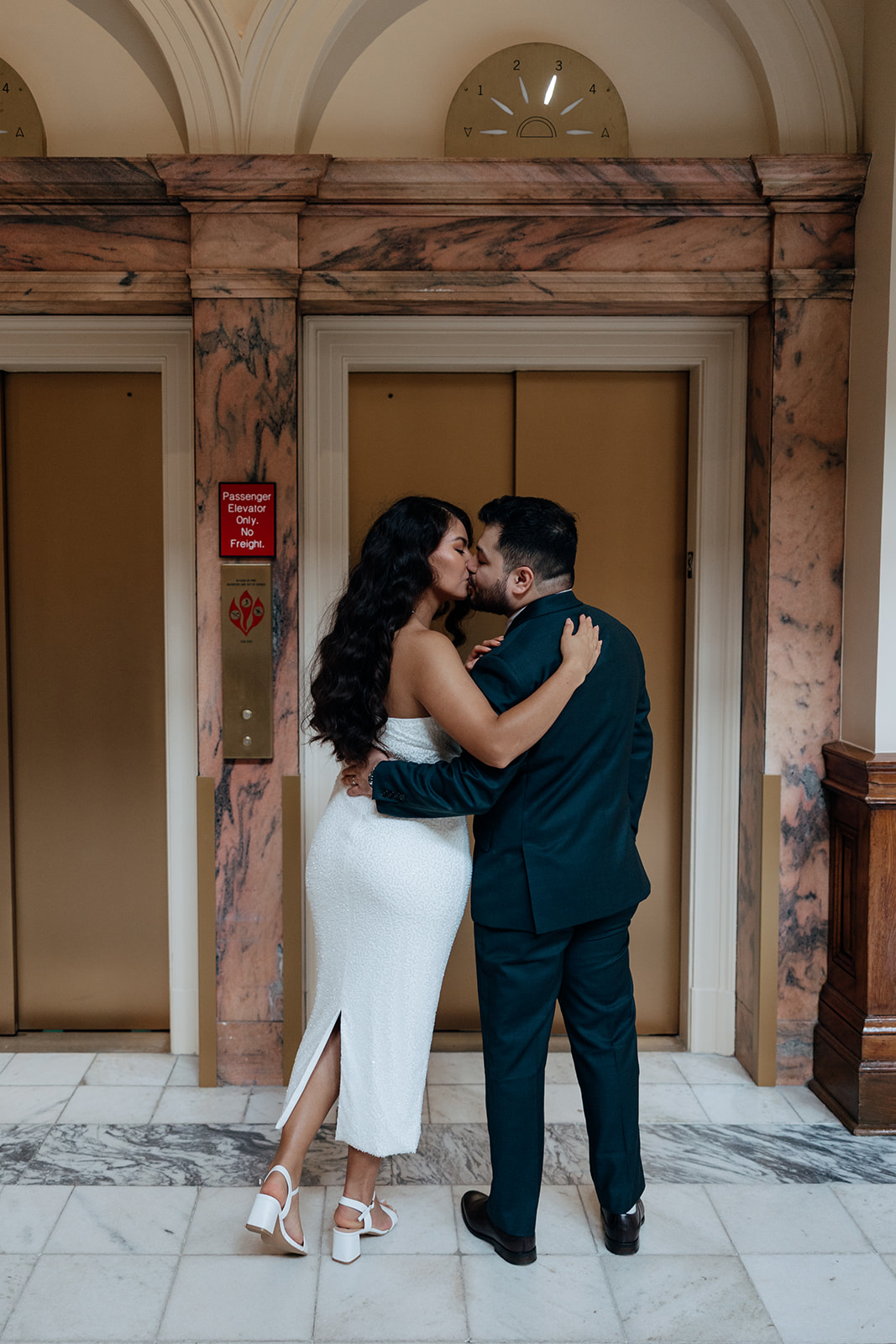 stunning bride and groom share a kiss outside during their Georgia state capitol elopement