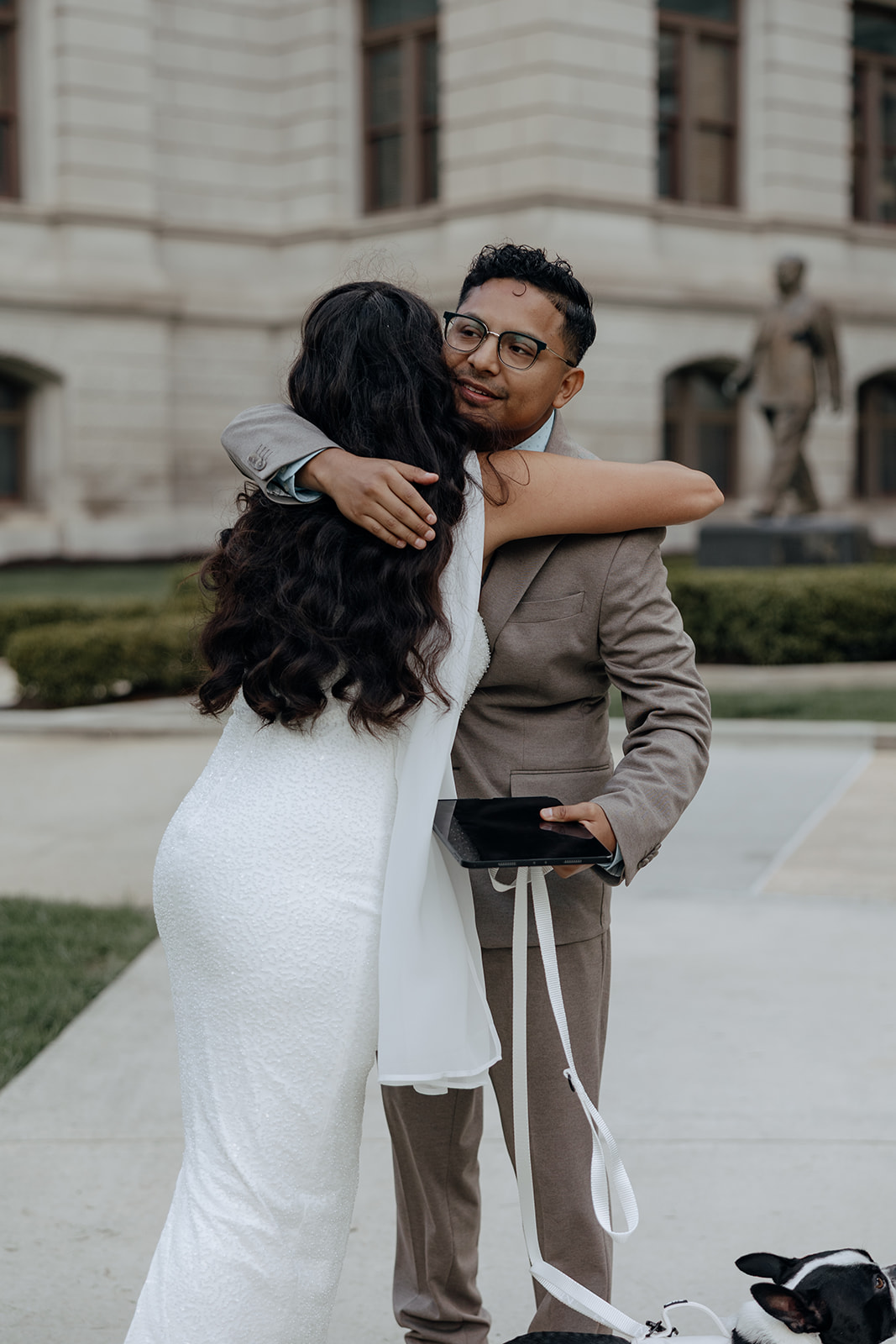bride shares a hug with the officiant after the stunning elopement day