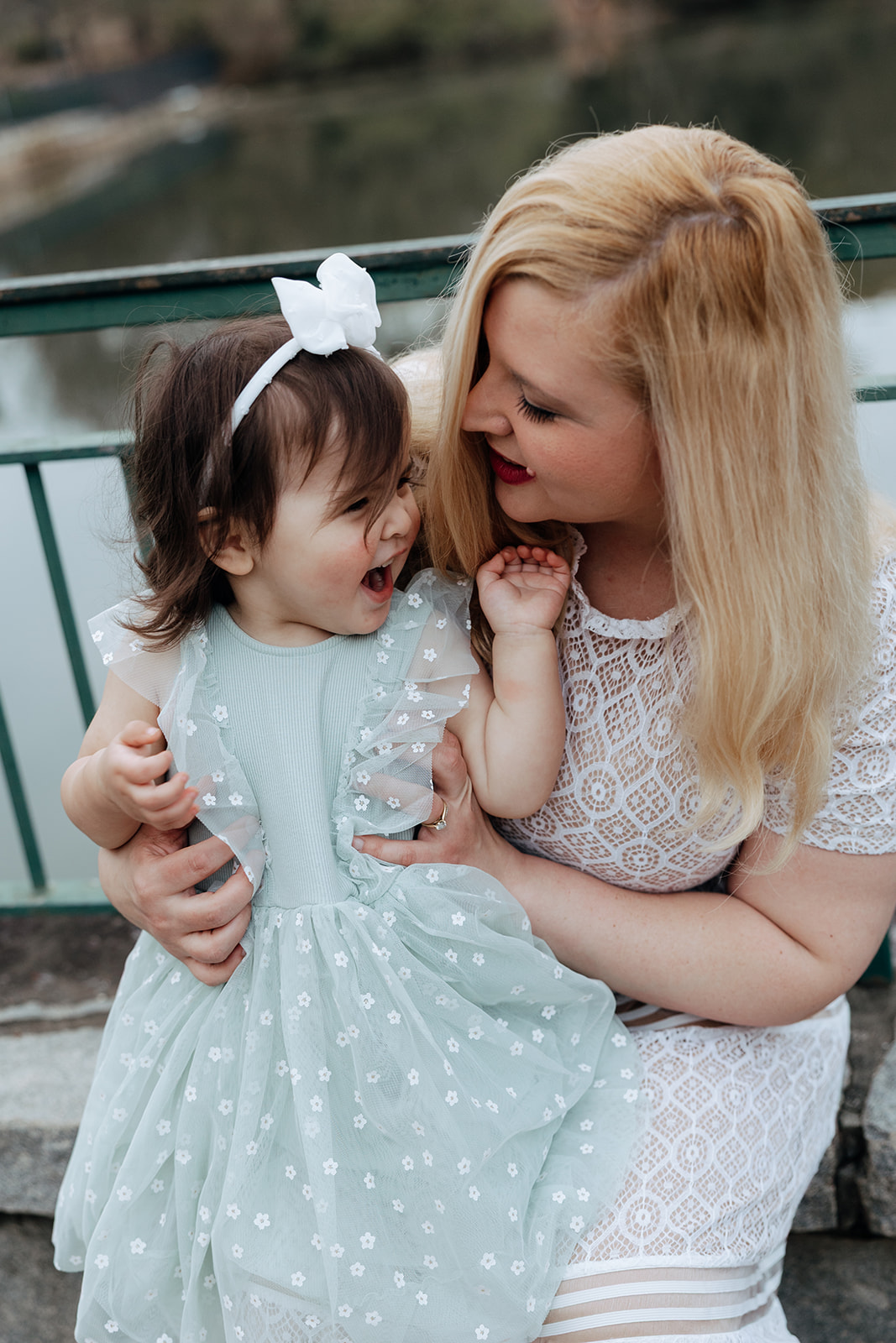 mother and daughter play in the Atlanta park together during her motherhood pictures  