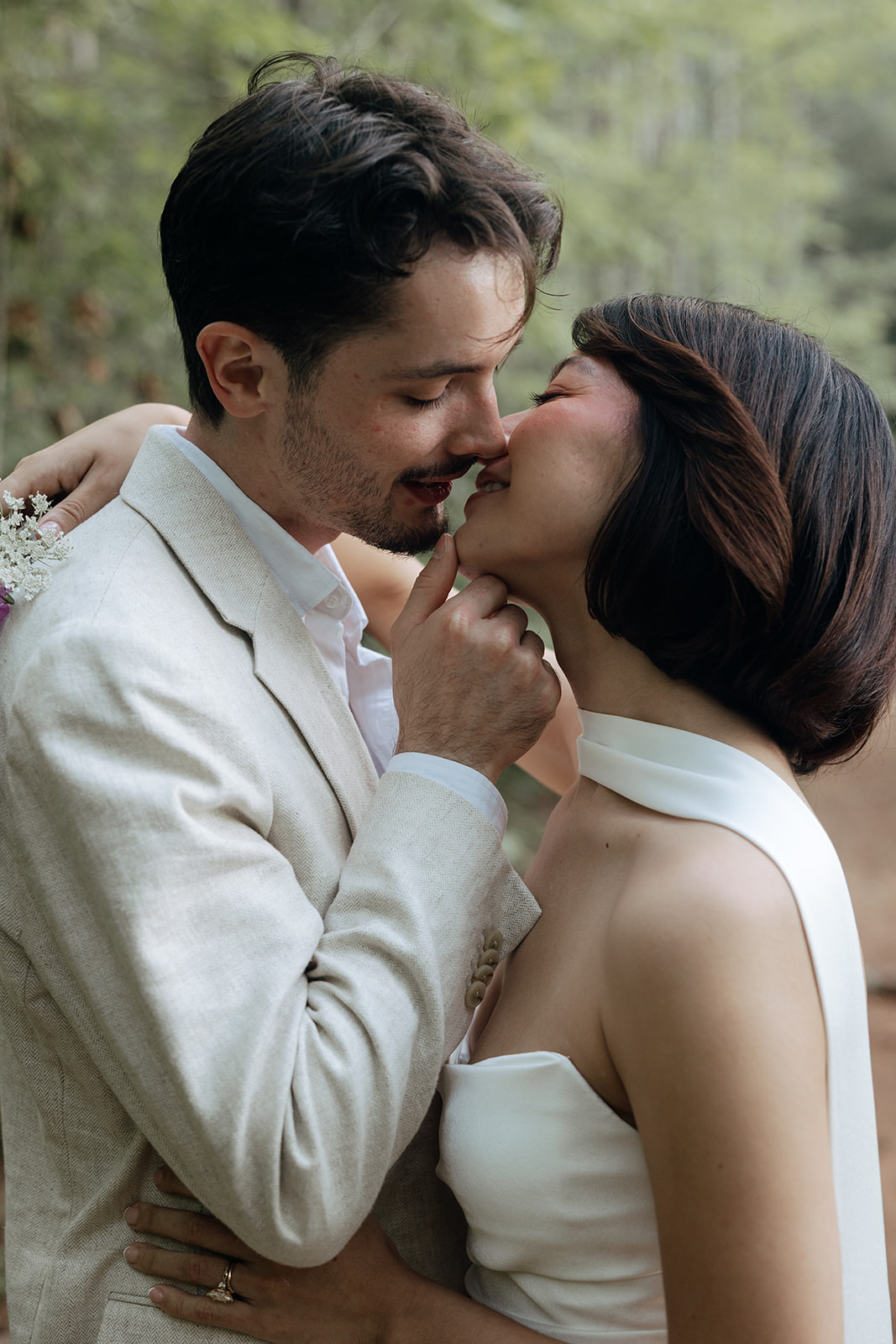 couple share a kiss after their lakeside dahlonega elopement