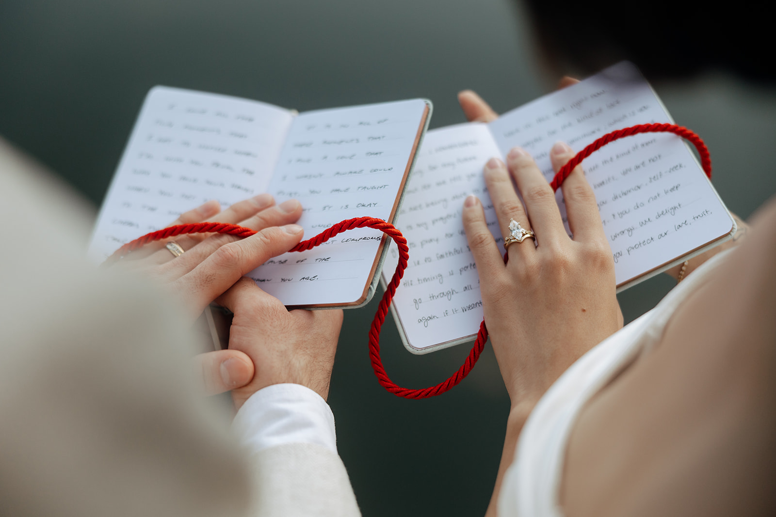 couple share intimate moments during their red string ceremony after their Georgia elopement day 