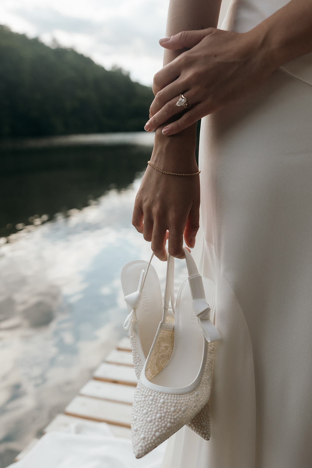 bride finalizes her prep for the Georgia elopement day with a little help from her soon to be husband